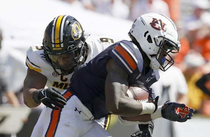 Sep 24, 2022; Auburn, Alabama, USA; Missouri Tigers defensive lineman Isaiah McGuire (9) tackled Auburn Tigers running back Tank Bigsby (4) during the fourth quarter at Jordan-Hare Stadium. Mandatory Credit: John Reed-USA TODAY Sports